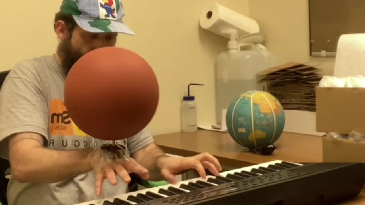 Playing Game Soundtrack On Piano While Spinning Basketball On Hand