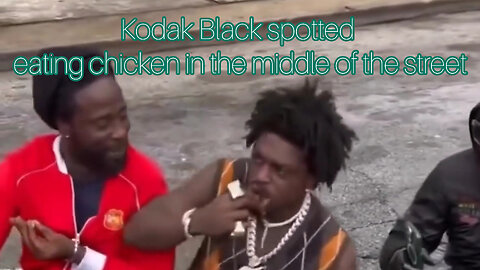 Kodak Black spotted eating chicken in the middle of the street by fans