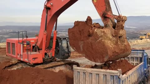 Hitachi Zaxis 670LCR Excavator Loading Mercedes And MAN Trucks