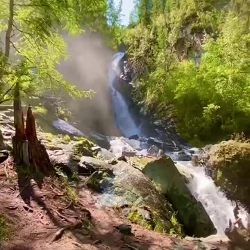 Cascade and waterfall in Altai Republic forest