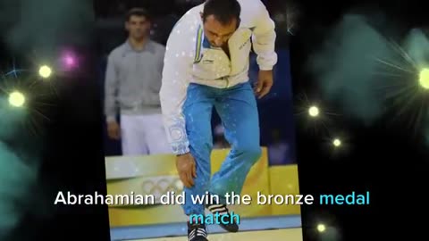 Ara Abrahamian place his bronze medal on the ground in 2008