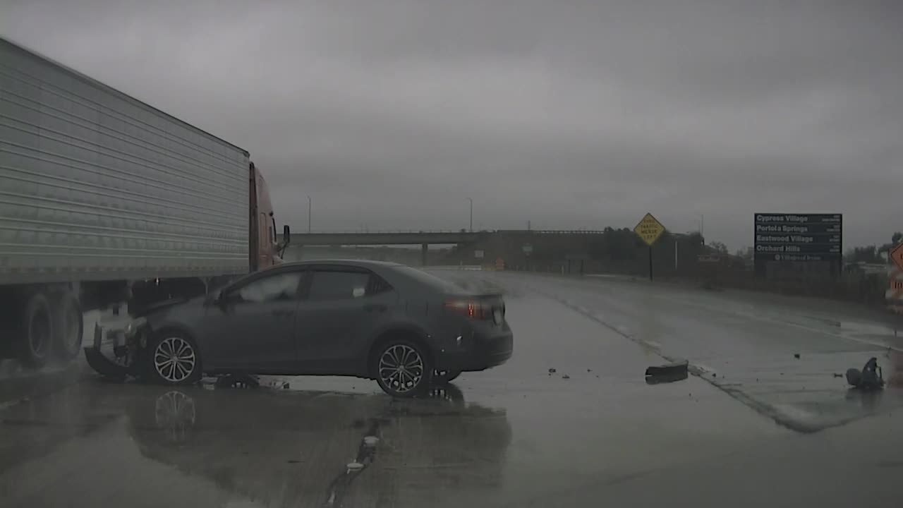 Allegedly Speeding Car Loses Control in Heavy Rain