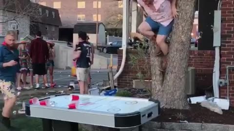 Drunk Man Jumps Through Air Hockey Table