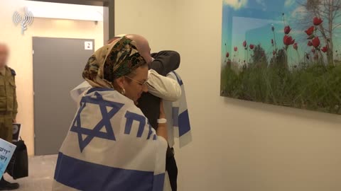 Released hostage Eitan Mor is seen reuniting with his parents, Efrat and Zvika,