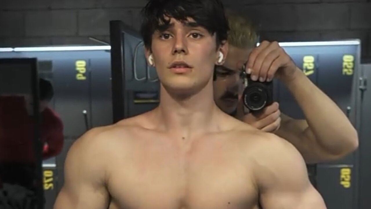 Handsome aesthetic bodybuilder showing off his muscles