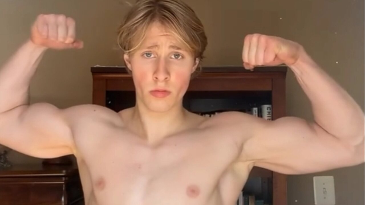 19 years old bodybuilder flexing muscles