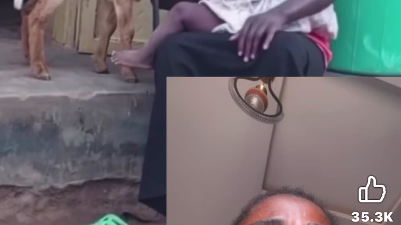 BLACK WOMAN BREST FEEDS VILLAGE GOAT