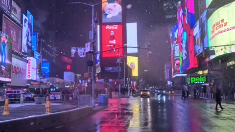 A rainy night in times square with neon lights