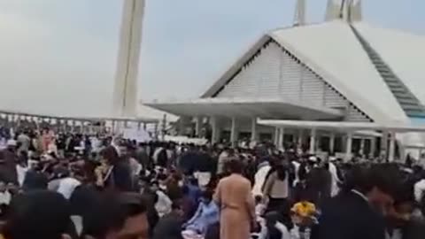 This is not a running competition, but people are pushing each other in Faisal Mosque for Iftar.