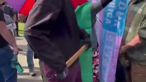 Antifa thug winds up to stab/beat someone in our crowd with a wooden stake.