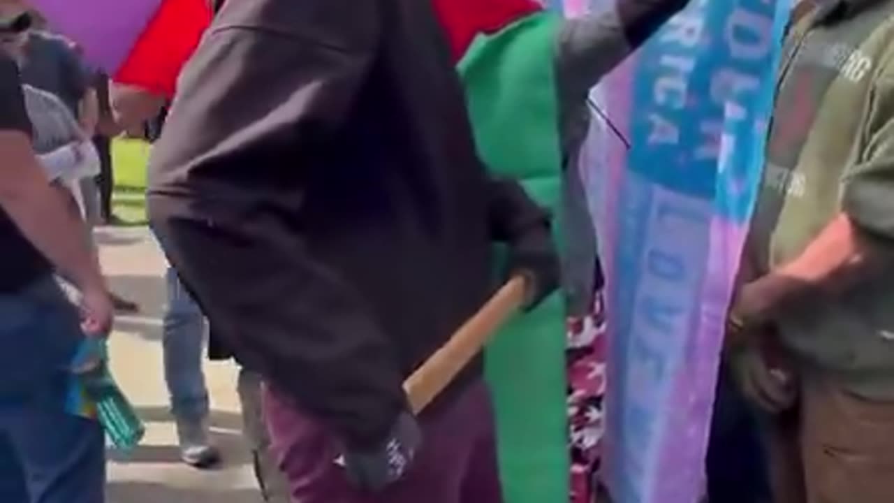 Antifa thug winds up to stab/beat someone in our crowd with a wooden stake.