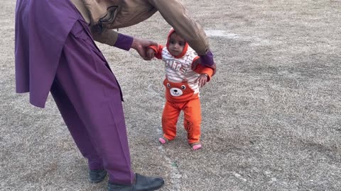 How To Walk? Son Learning From Dad