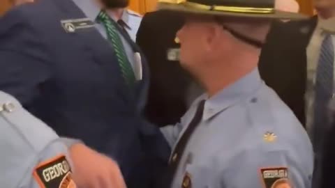 Senator Moore was shoved to the ground