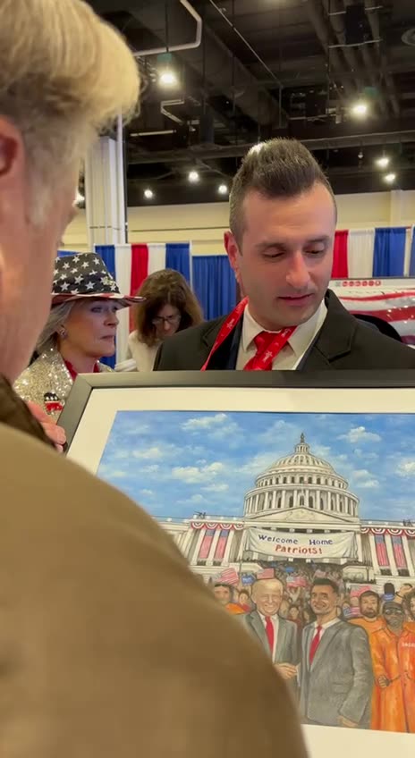 Bannon signs J6 pic Fellow Inmate