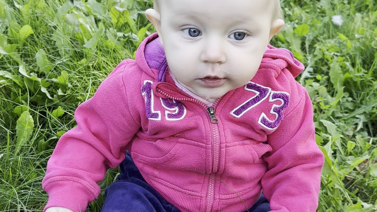 Tiny hands, big smiles 🌸 Baby Kayla holding a flower