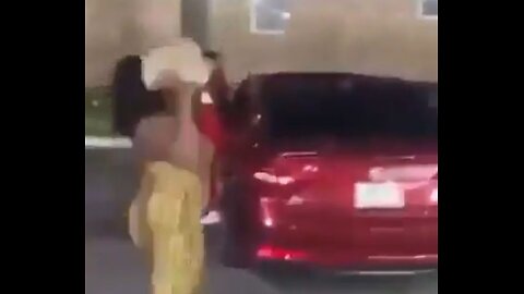 Women gang attack a woman after she throws large rock through car window