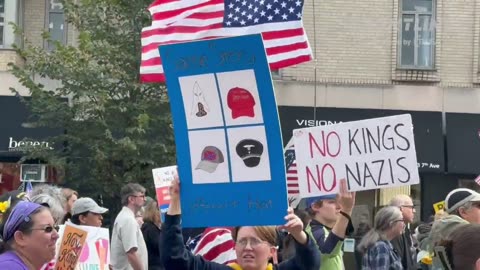 No Kings protesters in NYC depicting the MAGA hat as the modern day “KKK”