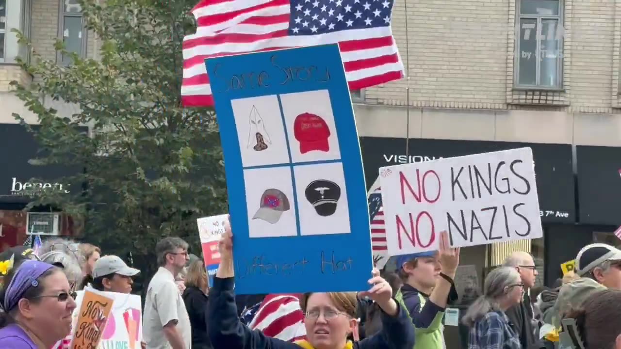 No Kings protesters in NYC depicting the MAGA hat as the modern day “KKK”