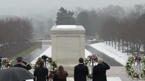 Taps plays as President Donald Trump salutes the Tomb of the Unknown Soldier