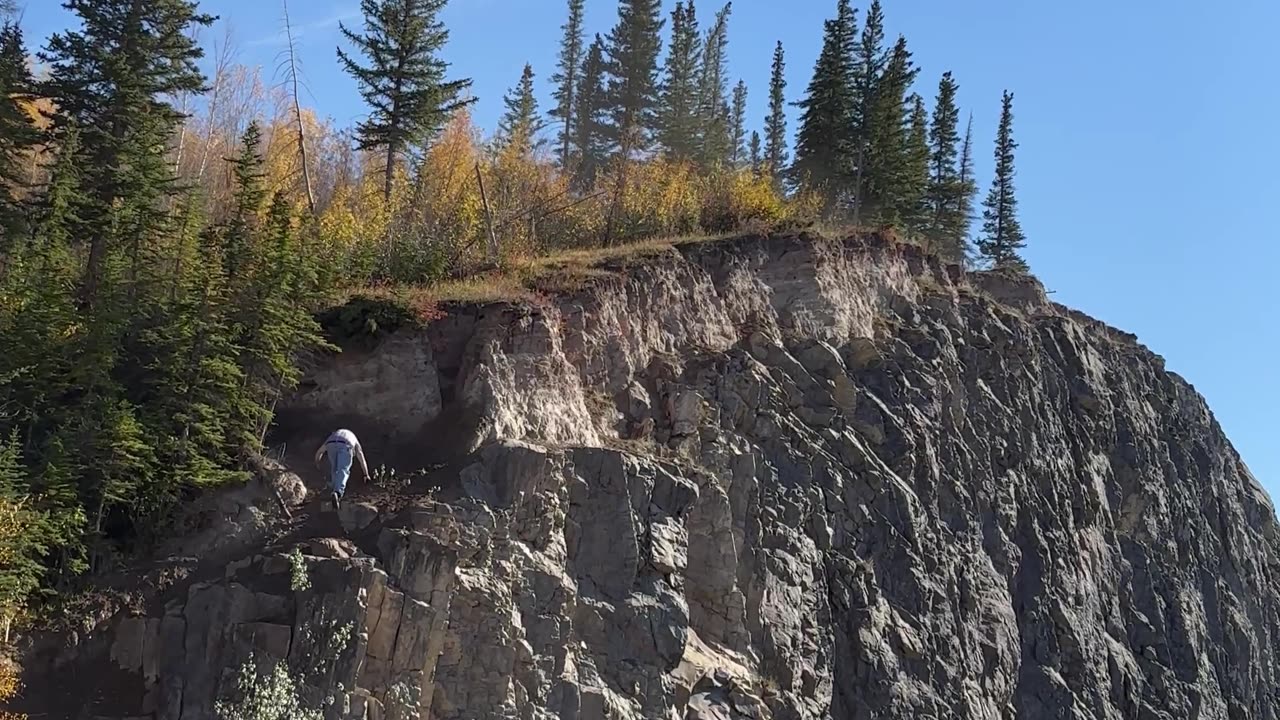 Man Chases His Dog Up Cliff