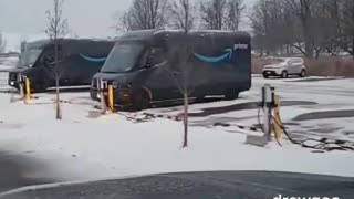 Amazon electric vehicles being charged in the snow - LOL The whole thing is a SCAM