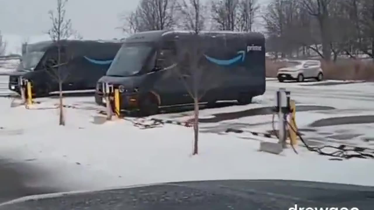 Amazon electric vehicles being charged in the snow - LOL The whole thing is a SCAM