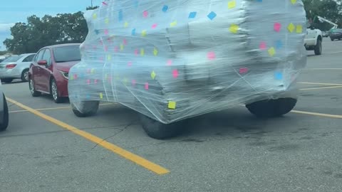 Parked Car Covered In Shipping Wrap