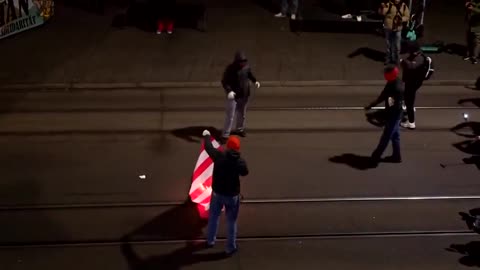 Protest in Zurich against Donald Trump by burning American flag