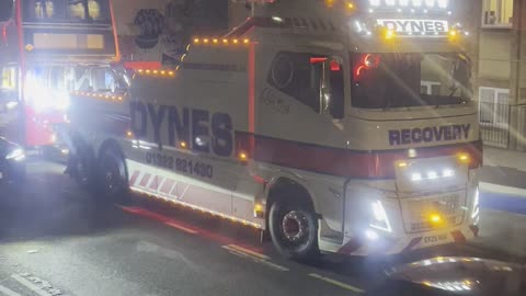 Recovery track attends to a damaged bus in east London
