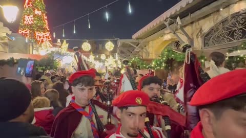Armenian and Palestinian Christian scouts marching at the Christmas Tree lighting in Jerusalem