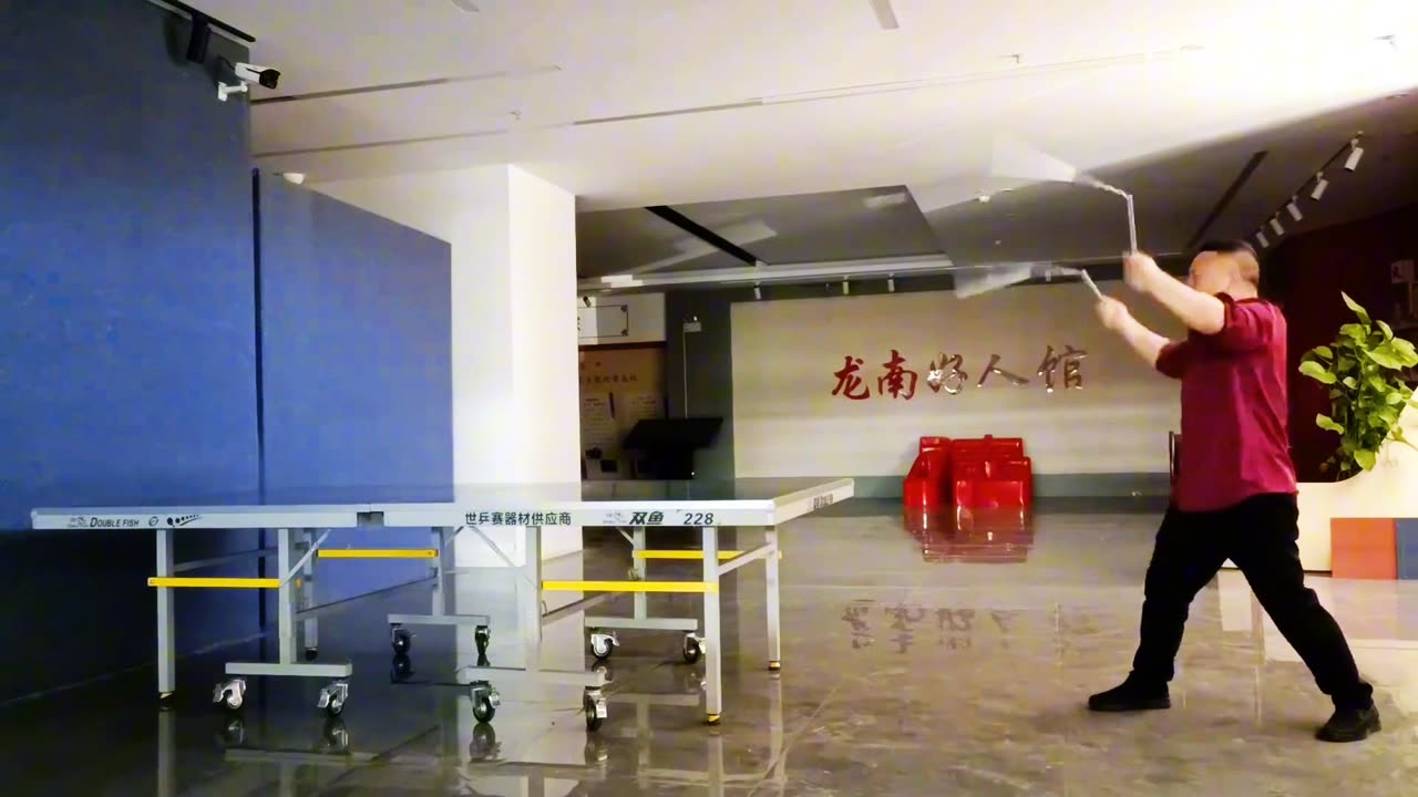 Play table tennis with nunchucks.