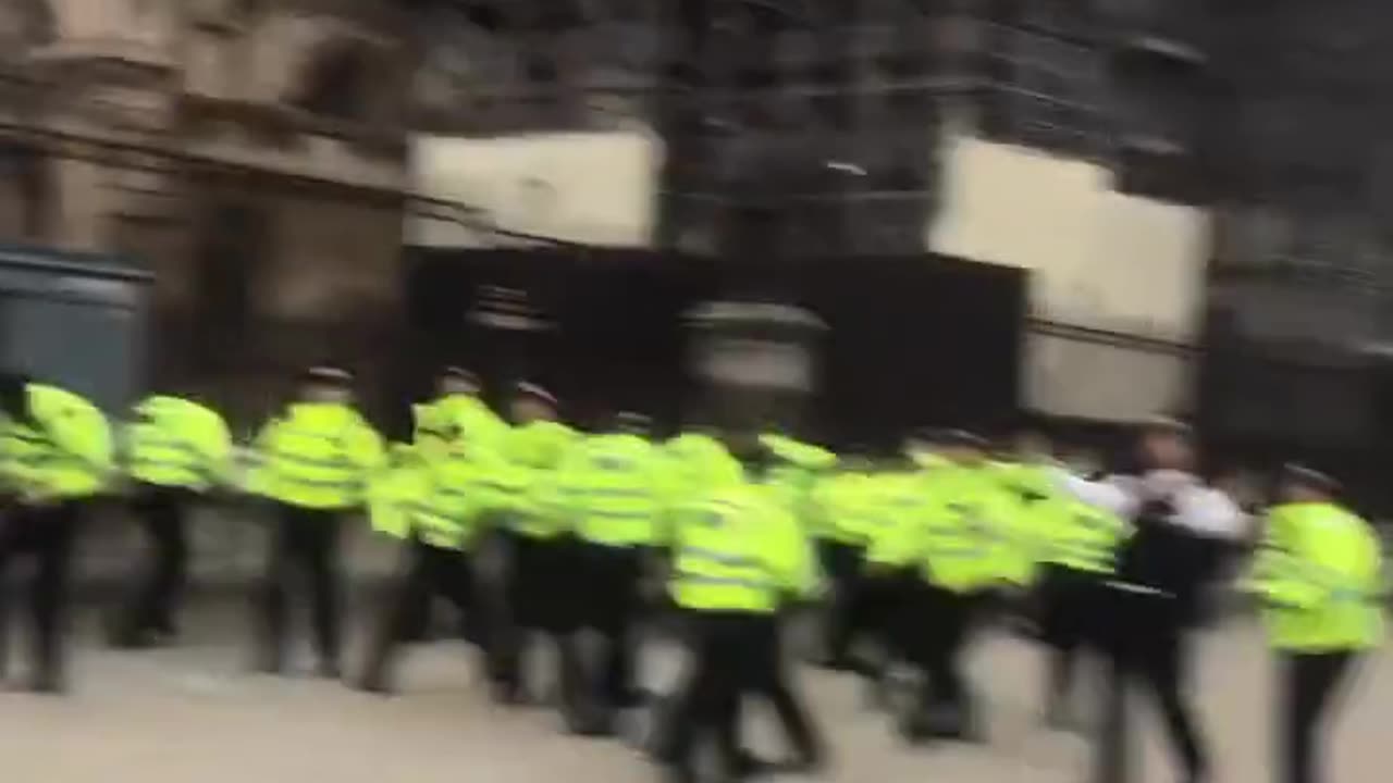 Police fleeing from a mob in London