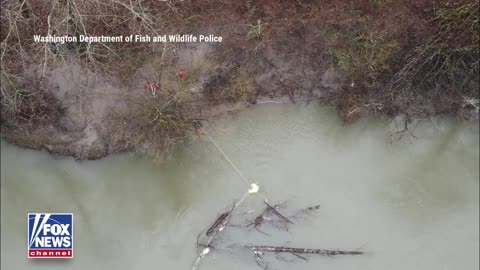 New footage shows the tense rescue of a man pulled to safety after clinging to