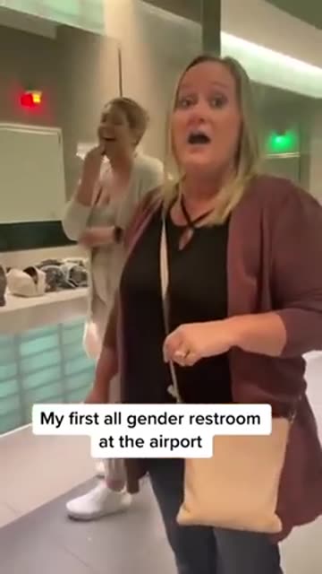 woman reviews her first first all gender restroom at the airport