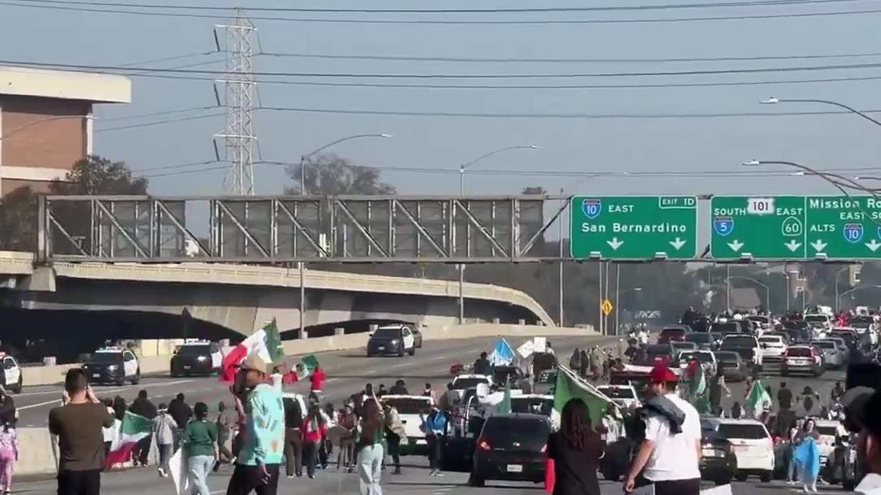 Los Angeles Police Standoff with Protesters March Against ICE Deportations