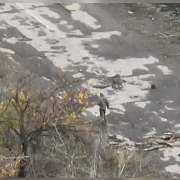 Russian Soldier Crawls Out of a Hole and Gets to Looting Comrades