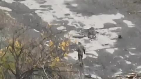 Russian Soldier Crawls Out of a Hole and Gets to Looting Comrades