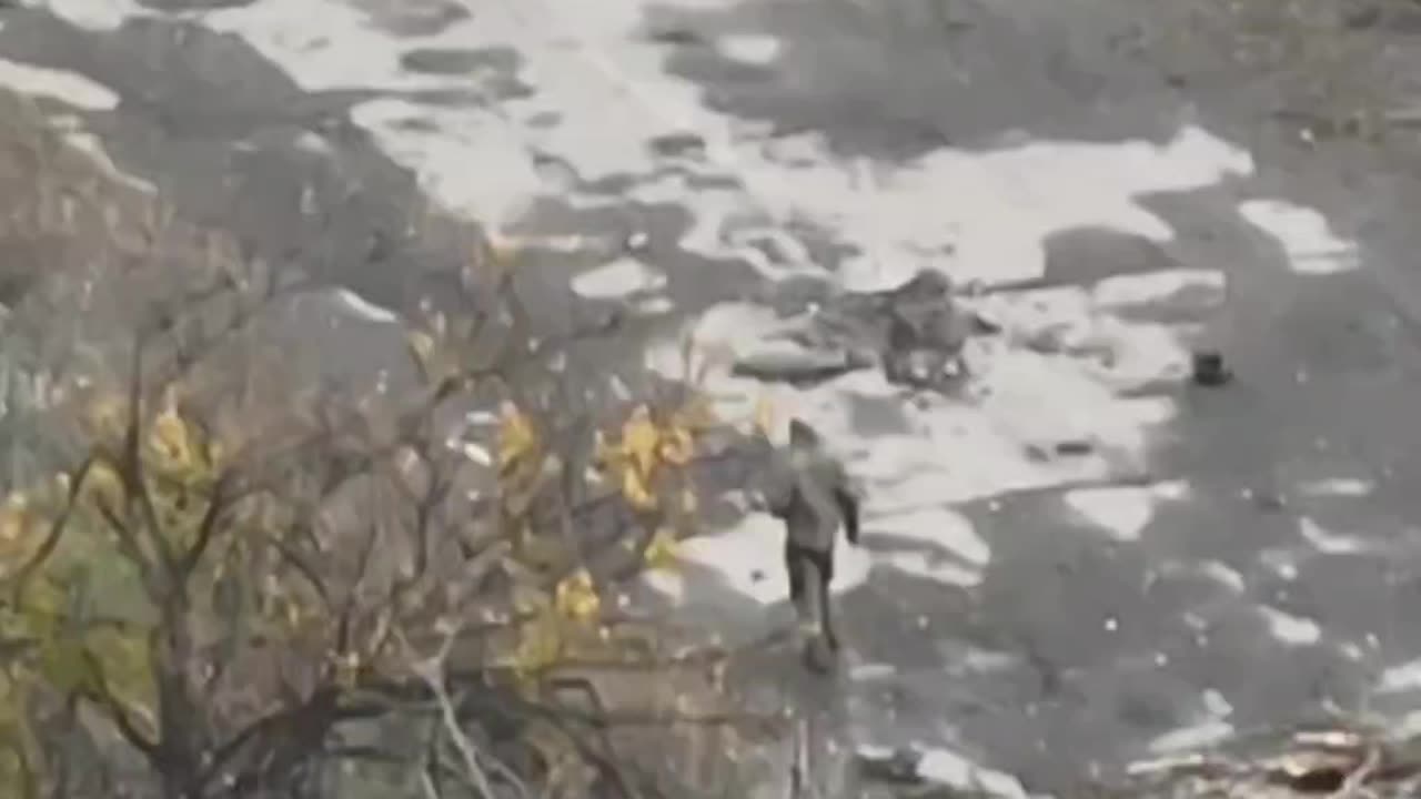 Russian Soldier Crawls Out of a Hole and Gets to Looting Comrades