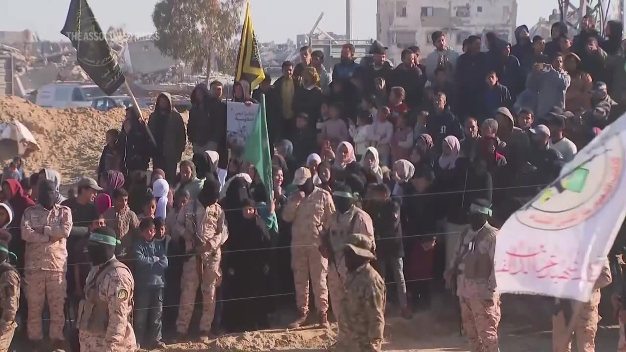 Crowd gathers as militants prepare to release more hostages