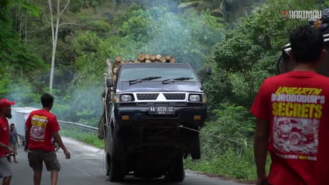 pick-up truck loaded with wood to jemping