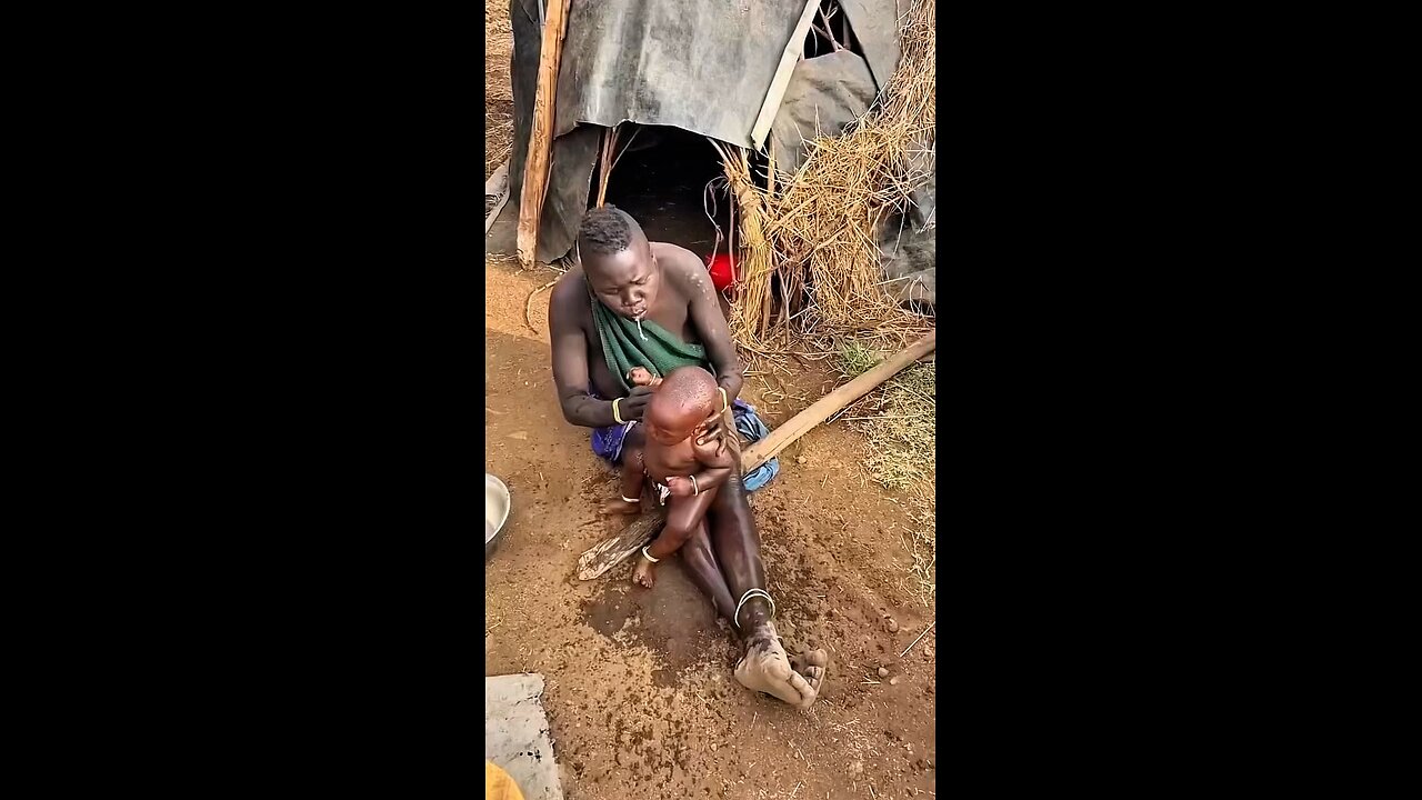 Traditional way of bathing a baby