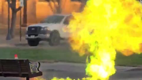 Green flames rise from a manhole at Texas Tech Campus in Lubbock