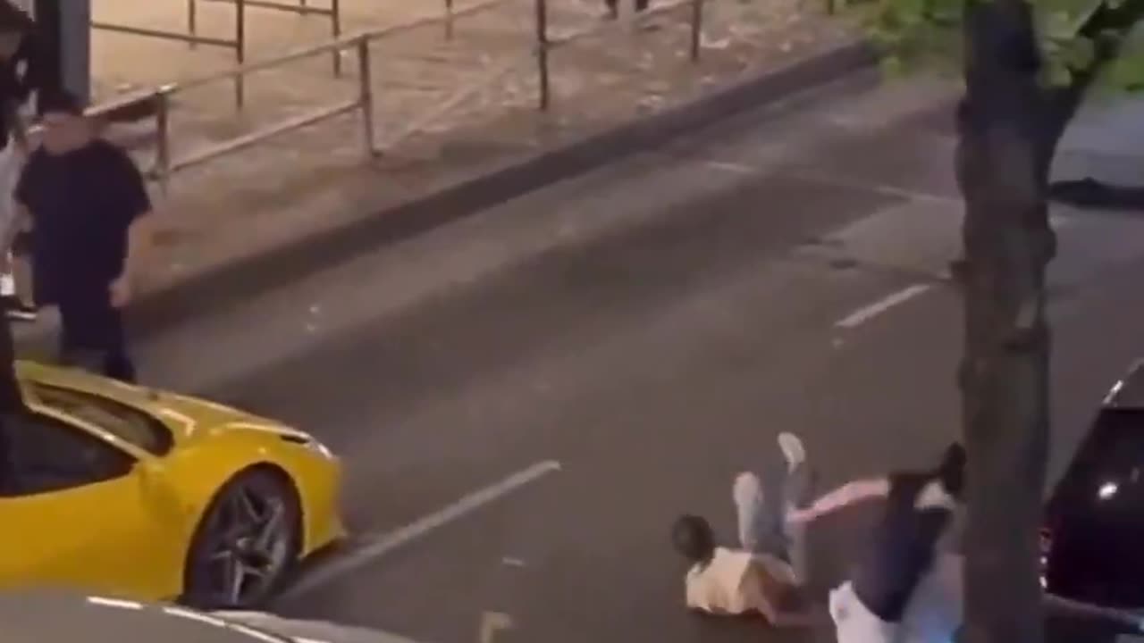 A German in Berlin explains to usual suspects not to touch his car.