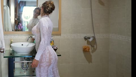 Transparent Cleaning mirror in bathroom with see throught white dress