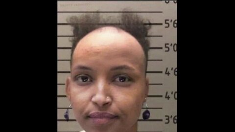 ilhan omar mugshot bald. Deport her and sieze assets as enter illegally. There for it's United State