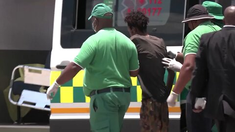 South African rescuers pull corpses and survivors from gold mine