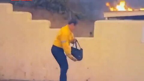 What Do Years Of Corrupt Governance Result In? LA Firefighter Trying To Put Out Fire With A Handbag