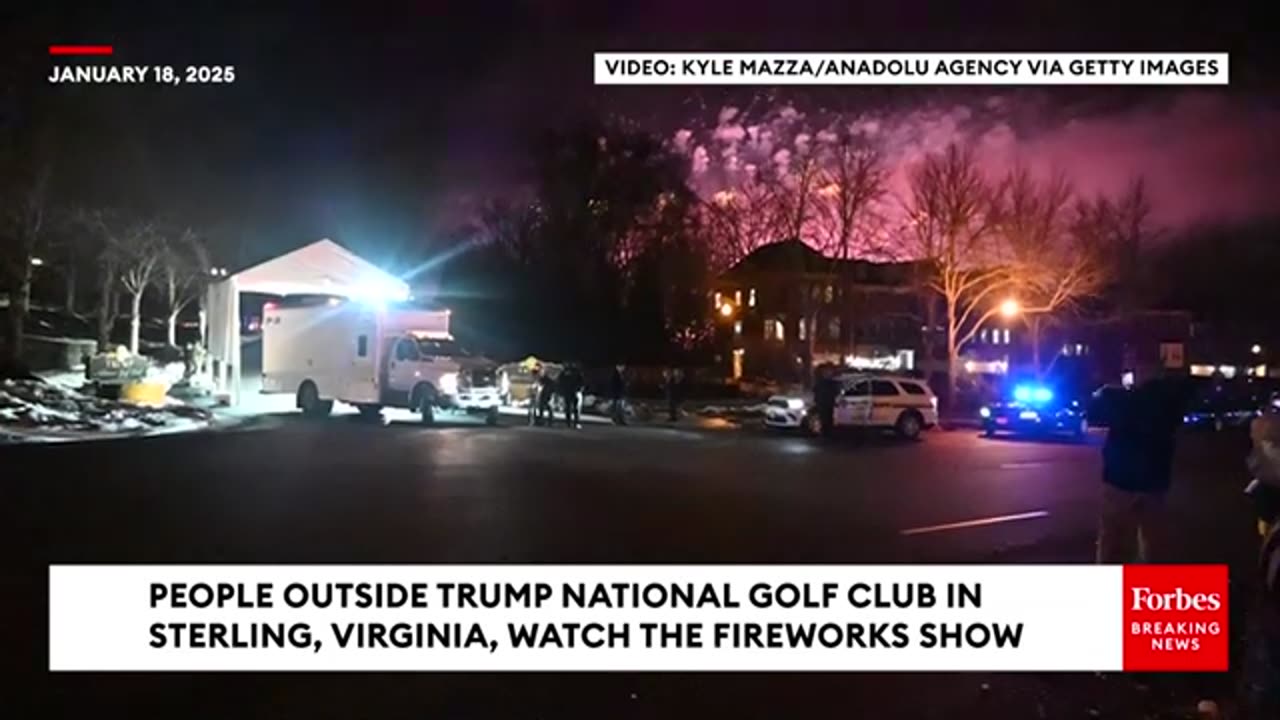 People gather outside the Trump National Golf Club to watch the pre-Inauguration fireworks show