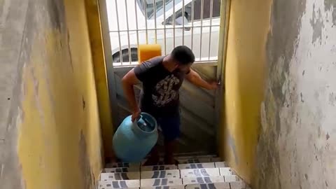 Goofy Gas Deliverer Trips On Stairs