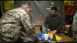 Volodymyr Zelensky eagerly signing a nazi SS flag